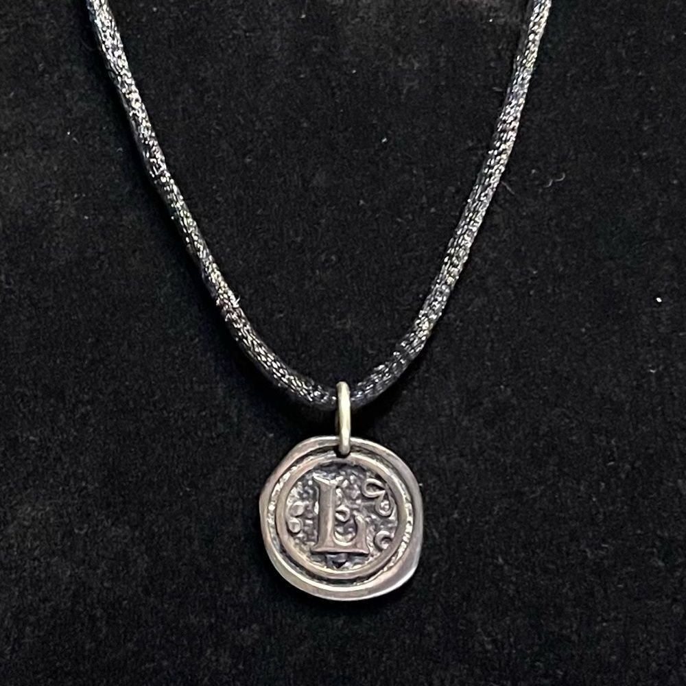 Black satin necklace with “L” medallion. - Picture 1 of 2